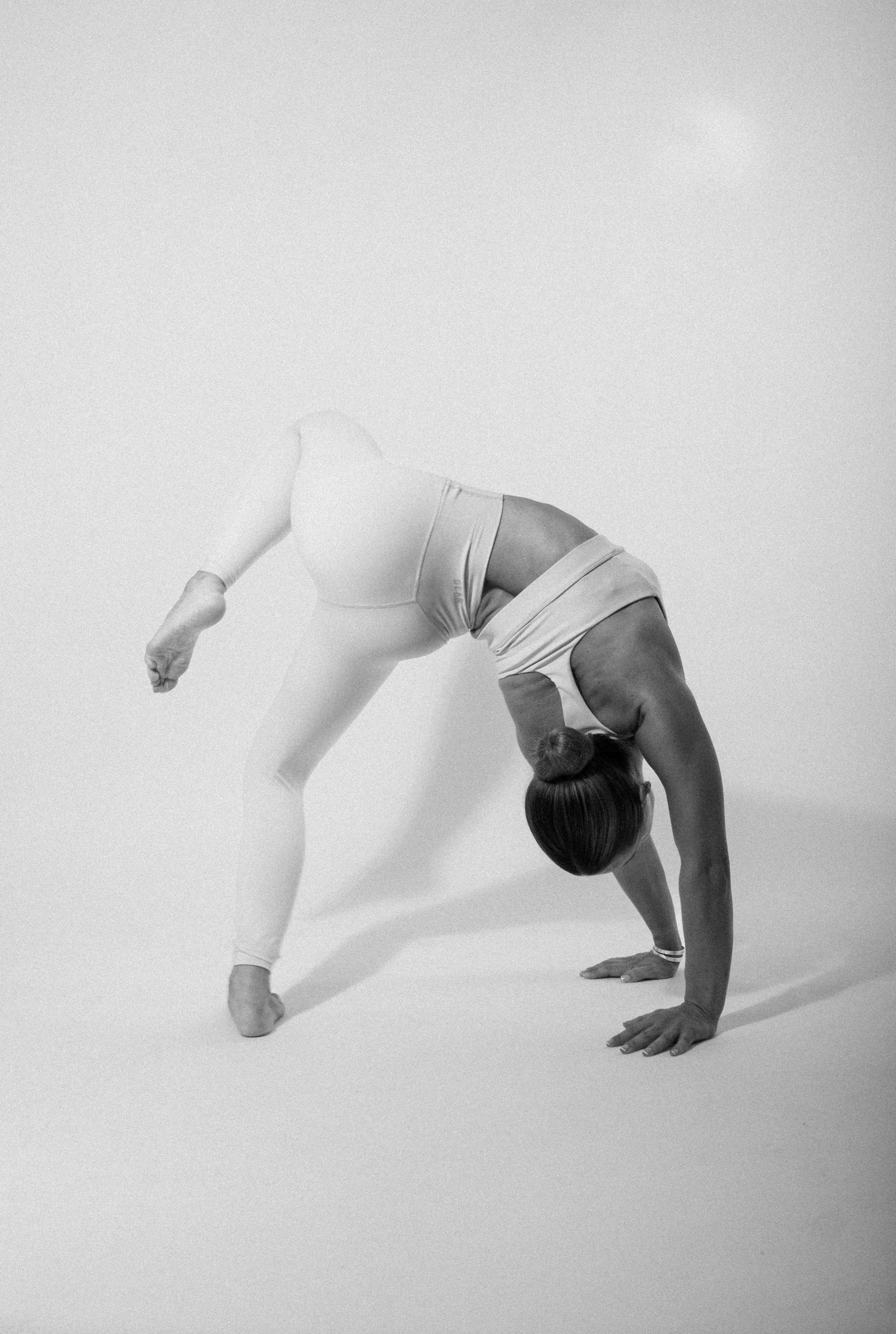 girl doing yoga pose wearing pilates gym set